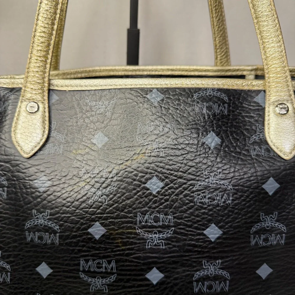 MCM Visetos Monogram Medium Tote Bag Black Gold‎ Lion Graphic Striped